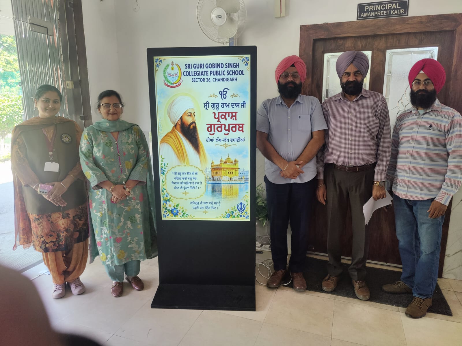 Principal and faculty with Gurpurab digital board